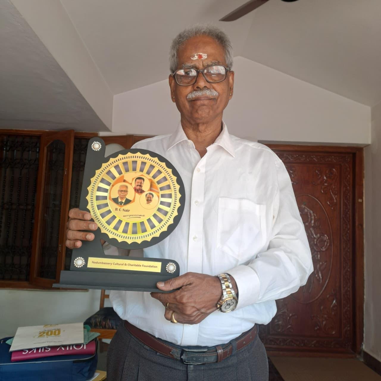 Rtn RC Nair with award from Nedumbassery Cultural & Charitable Foundation